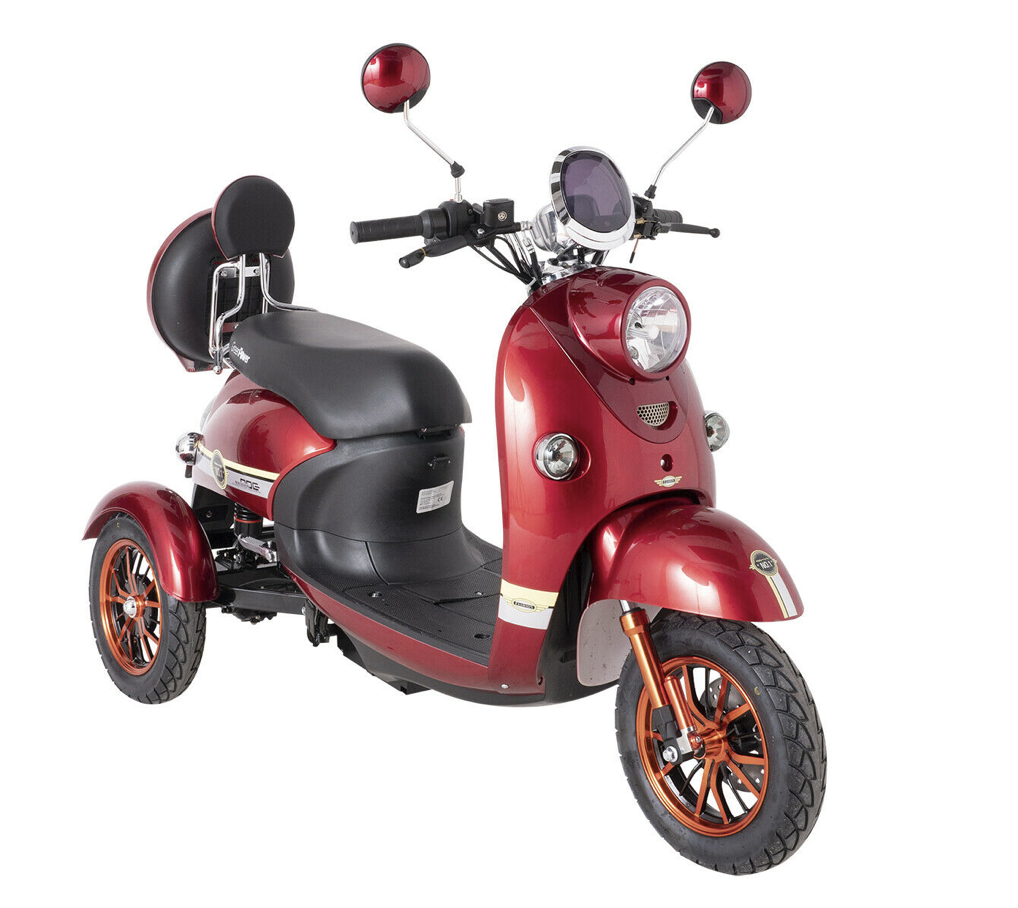 red three wheeled electric mobility scooter with headlamp, backrest, and streamlined mid-century modern style design. The scooter looks more like a three wheeled motor bike than a mobility scooter