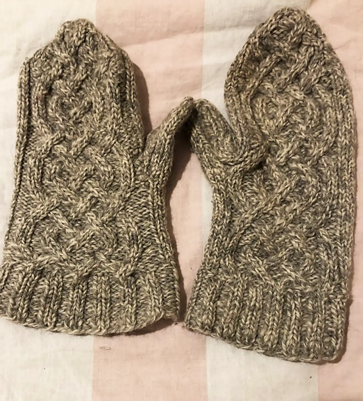 grey marle knitted mittens with a complex interlocking Celtic cable design